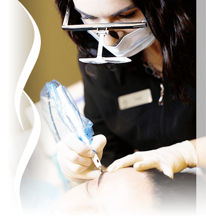 A picture of Lisette working, performing cosmetic tattoo eyebrow.