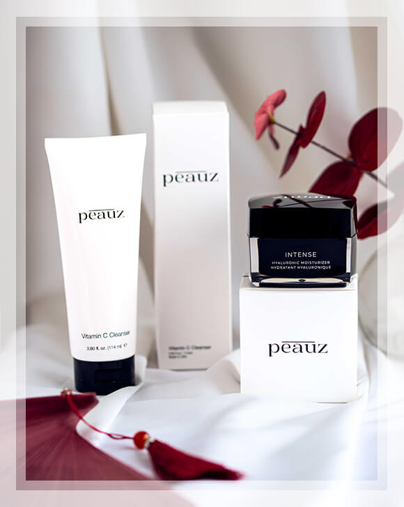 Three small containers of Peauz products
